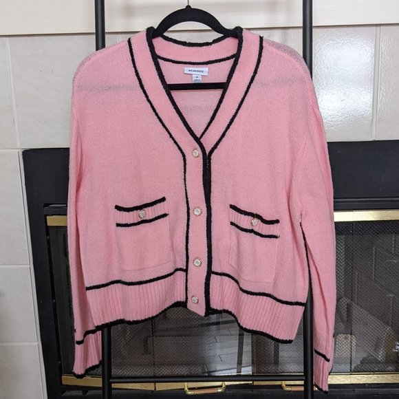 pink cardigan with black trim